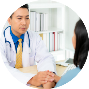 Doctor holding patient's hand.