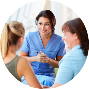 Nurse speaking to mother and her teen daughter.